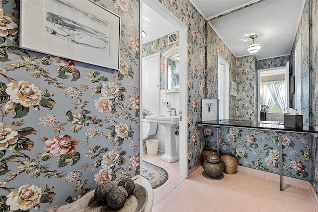 bathroom with tile patterned floors