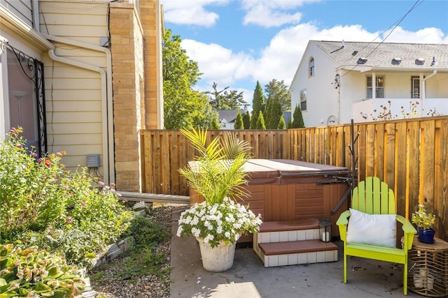 view of patio / terrace with a hot tub