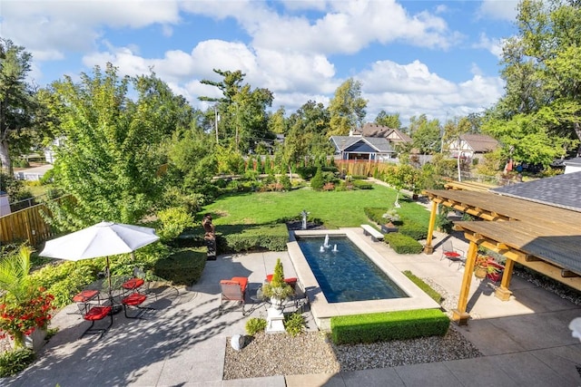 view of swimming pool featuring a yard and a patio