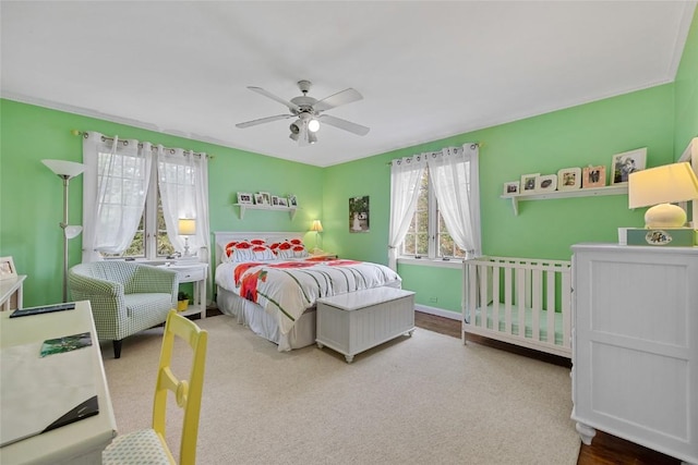 bedroom with ceiling fan and carpet