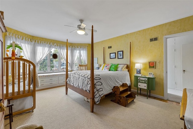 bedroom with ceiling fan and light colored carpet