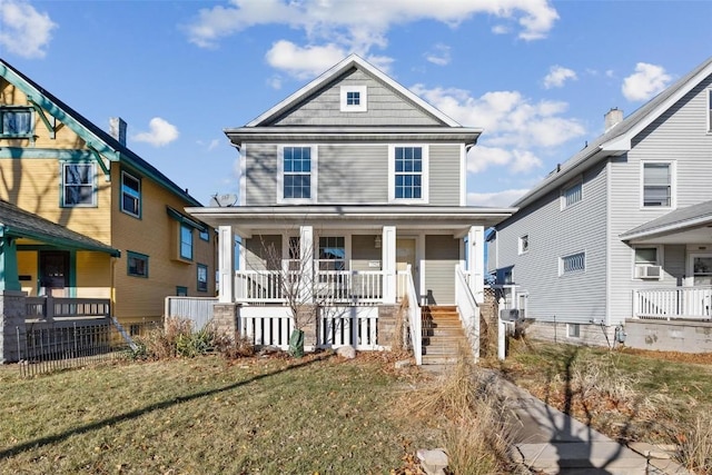 view of front of home featuring a porch, cooling unit, and a front lawn