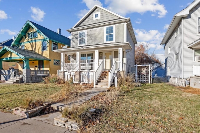 view of front facade with a front lawn and a porch