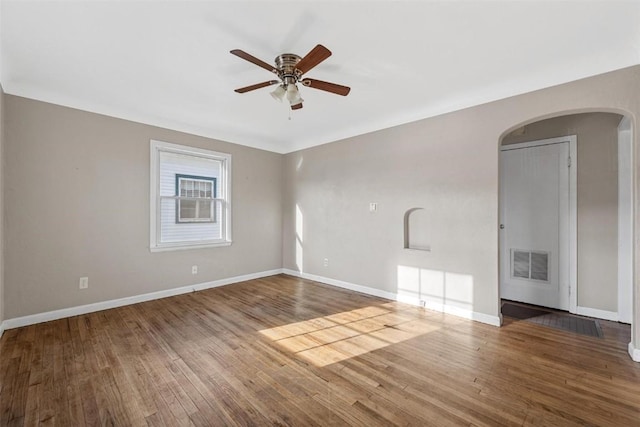 unfurnished room with hardwood / wood-style floors and ceiling fan