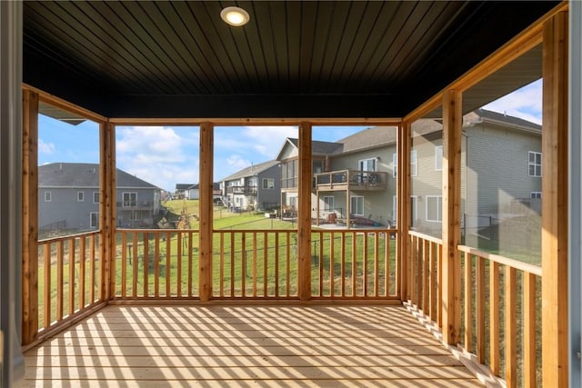 unfurnished sunroom featuring a residential view