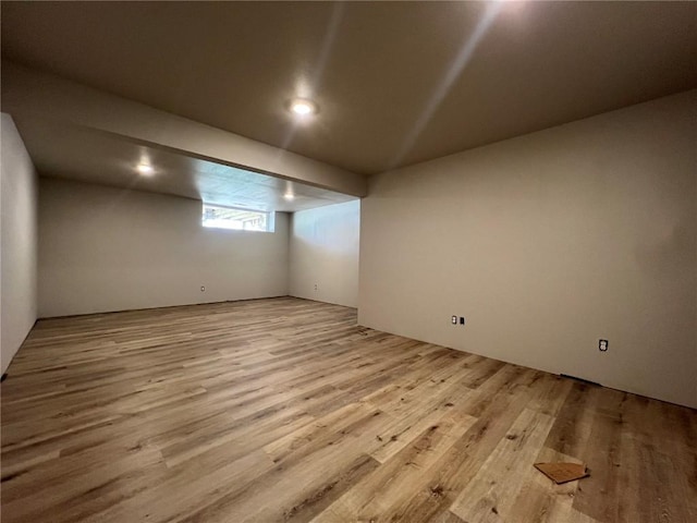 below grade area featuring wood finished floors