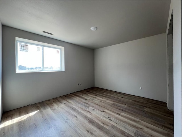 empty room with wood finished floors