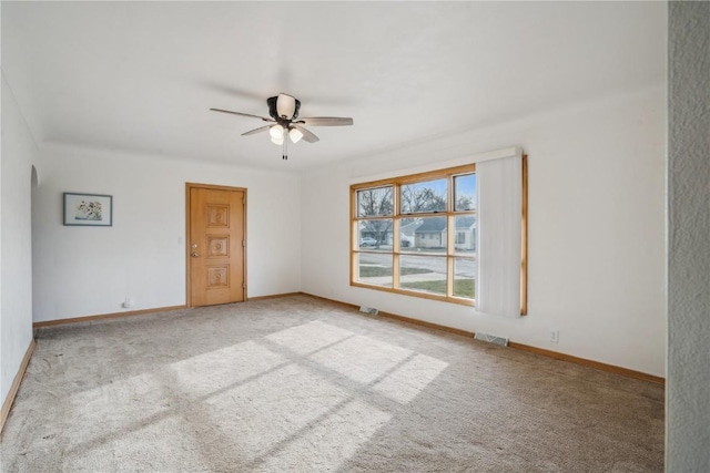 carpeted empty room with ceiling fan