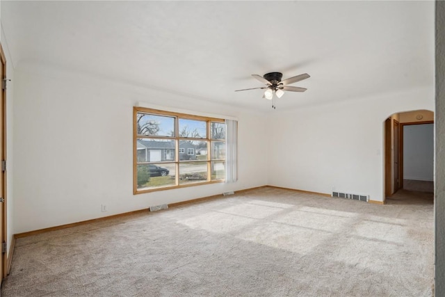 carpeted empty room featuring ceiling fan