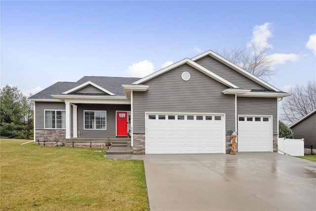 craftsman-style home featuring a front yard and a garage