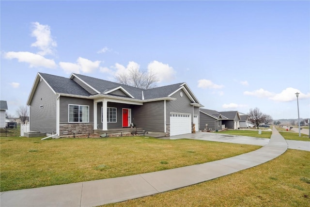 view of front facade with a garage and a front yard