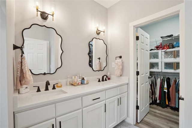 bathroom featuring vanity and hardwood / wood-style flooring