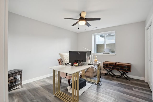 office with hardwood / wood-style floors and ceiling fan