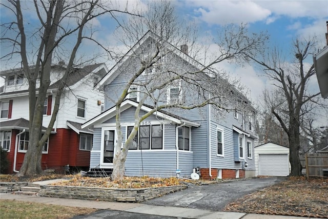 view of front facade with a garage and an outdoor structure