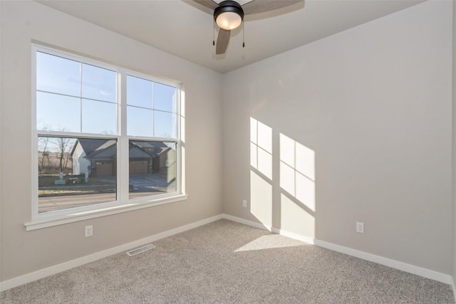 carpeted empty room with ceiling fan