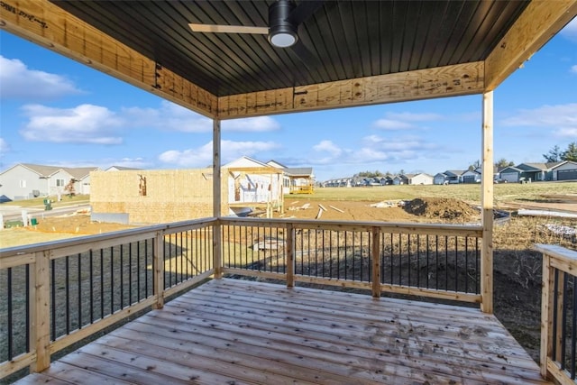 wooden terrace featuring ceiling fan