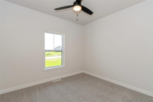 unfurnished room with ceiling fan and carpet floors