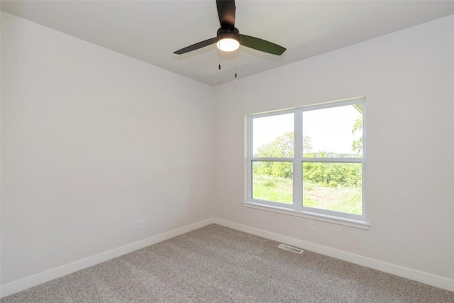 carpeted empty room with ceiling fan