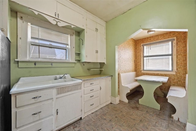 bathroom featuring vanity and parquet flooring