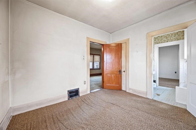 unfurnished bedroom with carpet and ornamental molding