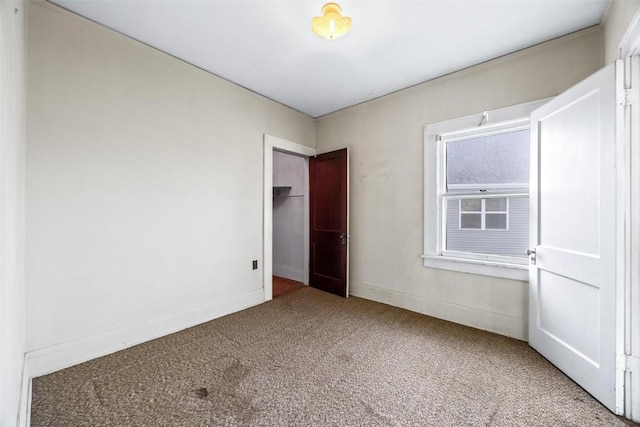 unfurnished bedroom with carpet flooring