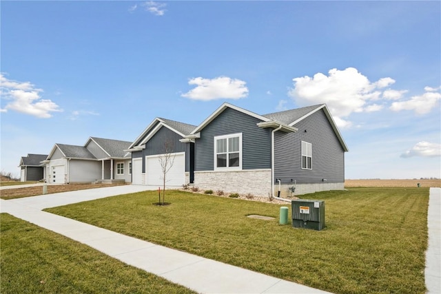 view of front of property with a front yard and a garage