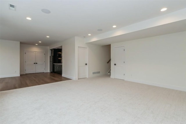 unfurnished room featuring dark hardwood / wood-style flooring