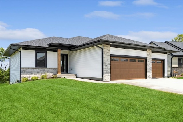 prairie-style house with a front lawn and a garage