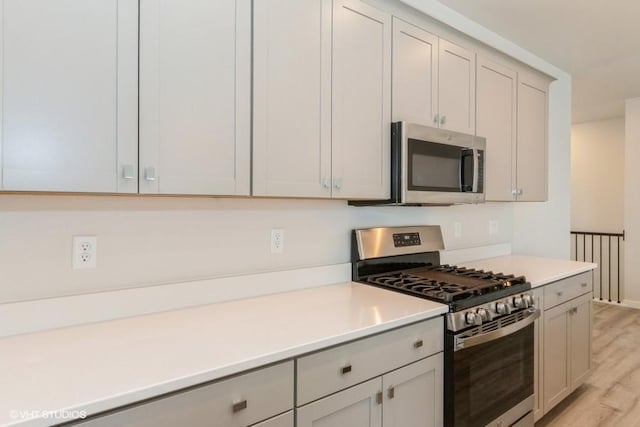 kitchen featuring light wood-type flooring and stainless steel appliances