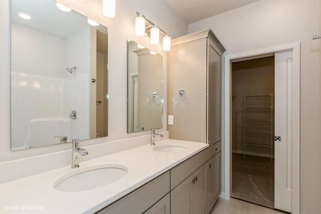 bathroom with vanity and walk in shower