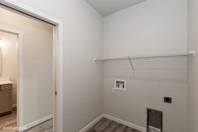 laundry room featuring light hardwood / wood-style floors, washer hookup, and hookup for an electric dryer