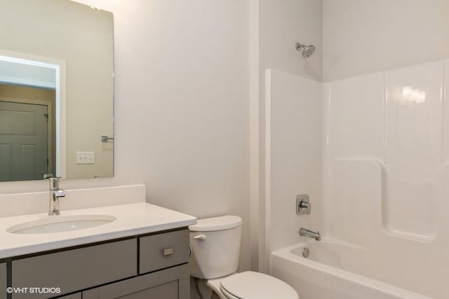 full bathroom featuring shower / tub combination, vanity, and toilet