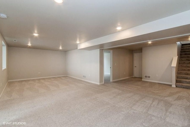 basement with light colored carpet