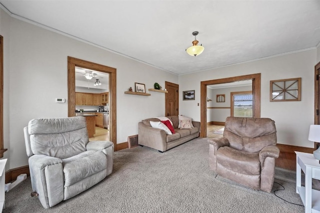 living room with light carpet and crown molding