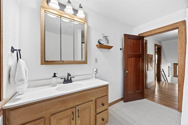 bathroom featuring vanity and hardwood / wood-style flooring