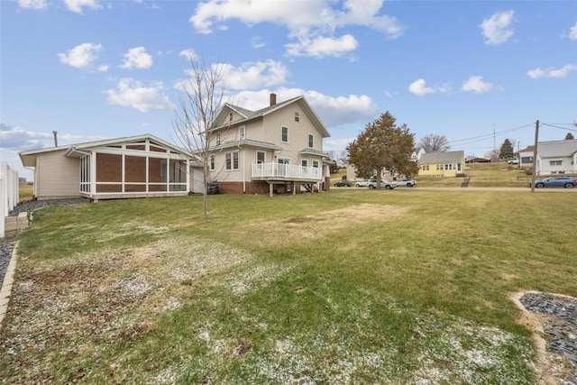 view of yard featuring a sunroom