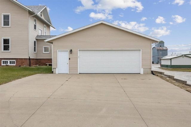 view of side of home with a garage