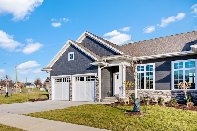 craftsman-style house with a front yard and a garage