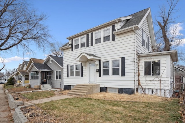 colonial-style house with a front lawn