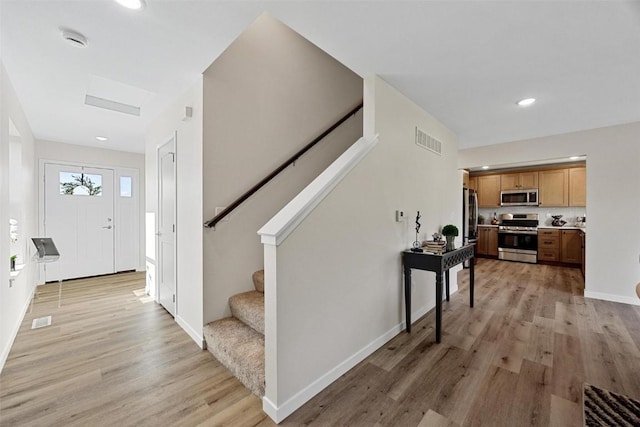 entryway with light wood-type flooring