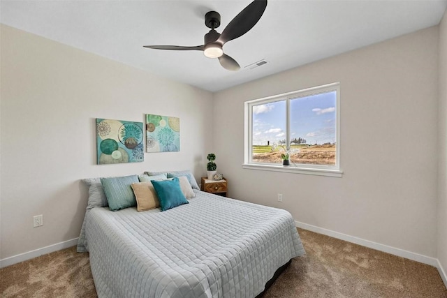 bedroom with ceiling fan and carpet floors