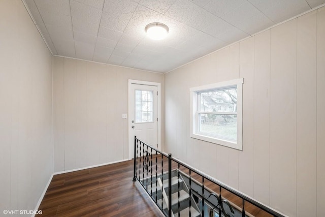 staircase featuring hardwood / wood-style flooring