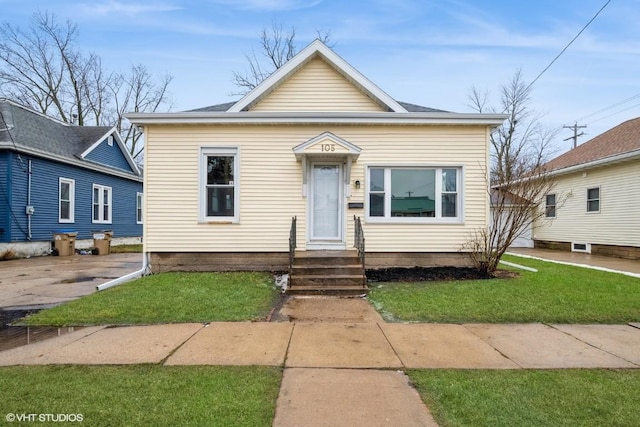 bungalow-style home featuring a front yard