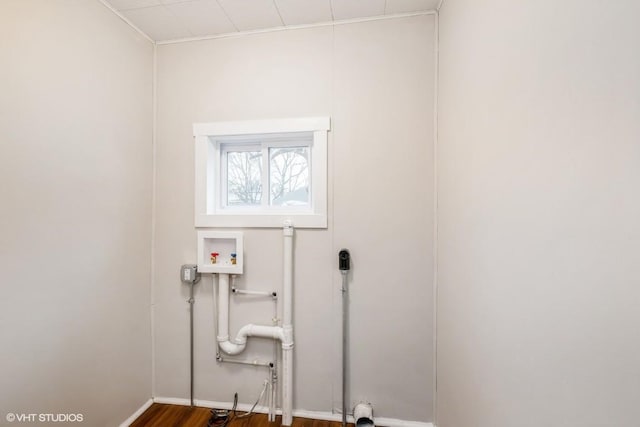 washroom with hookup for a washing machine and dark hardwood / wood-style floors