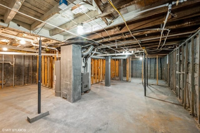 basement featuring gas water heater