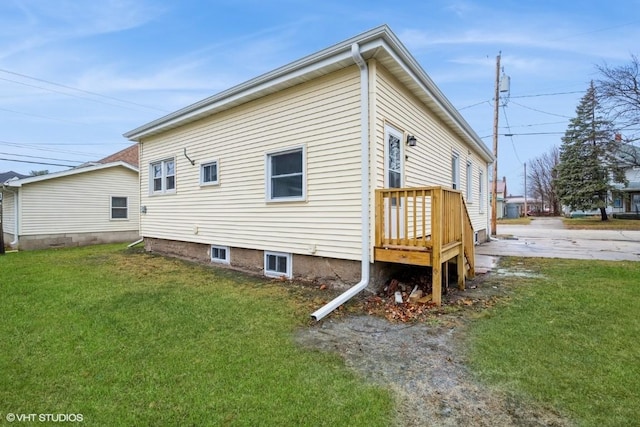 view of property exterior with a yard