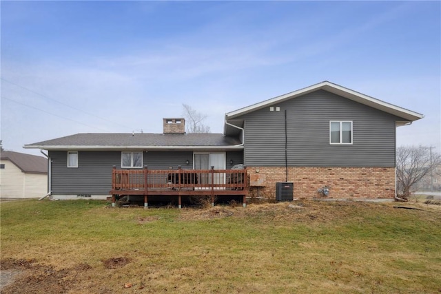 back of property featuring a yard, central AC unit, and a wooden deck