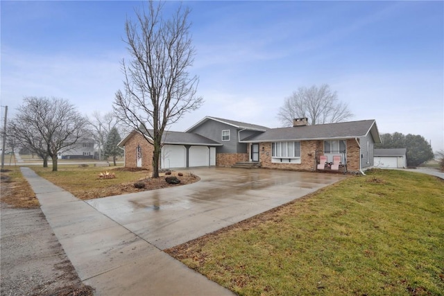 view of front of house with a front yard and a garage