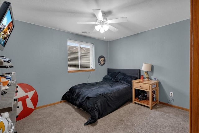 carpeted bedroom with ceiling fan