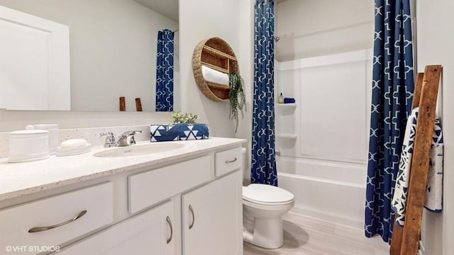 full bathroom with hardwood / wood-style flooring, shower / bath combination with curtain, toilet, and vanity